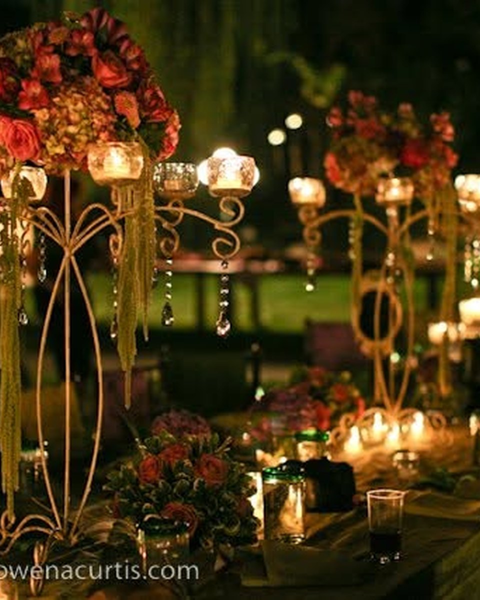 Candlelit evening table with elevated floral arrangements