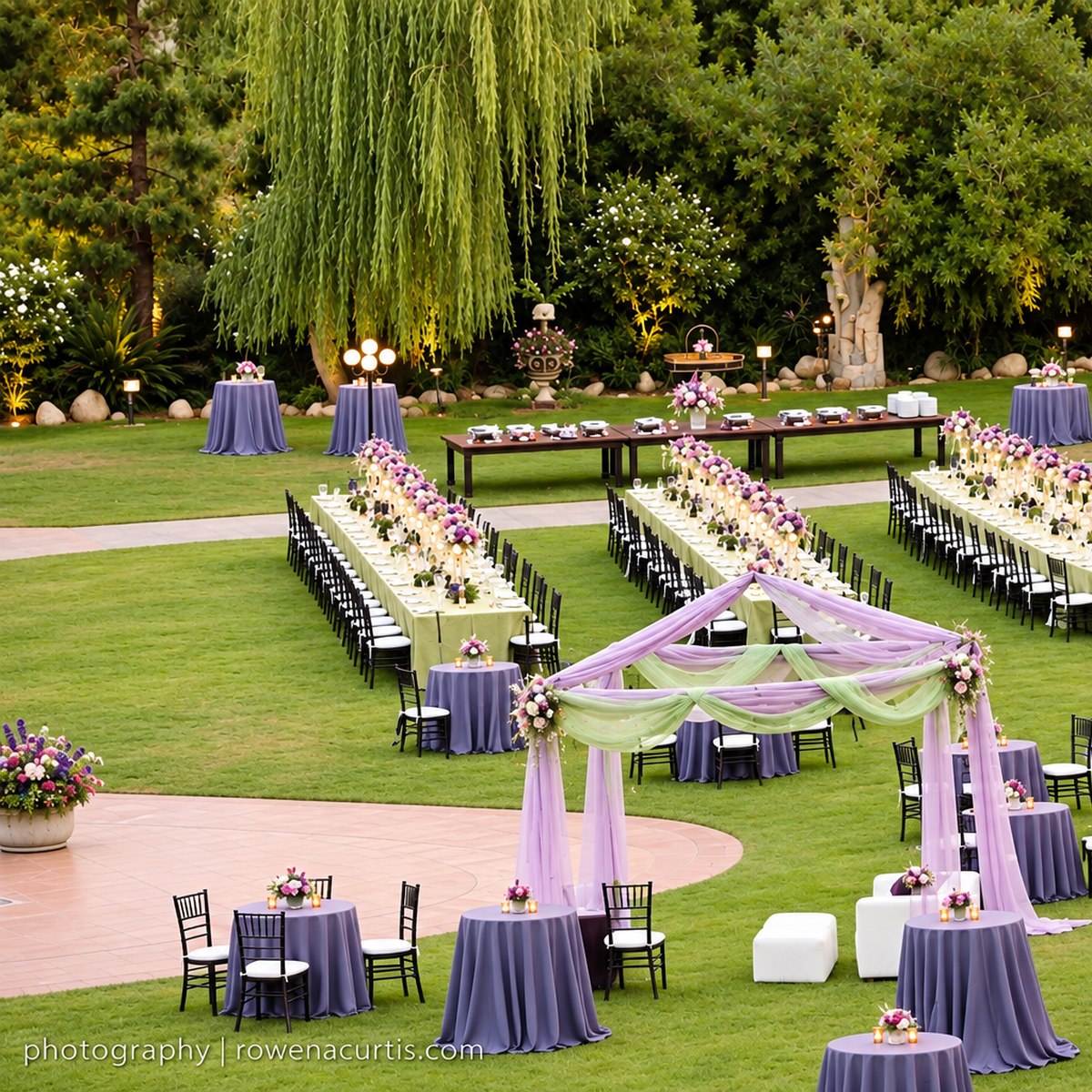 Garden gala with long dining tables and lavender draping