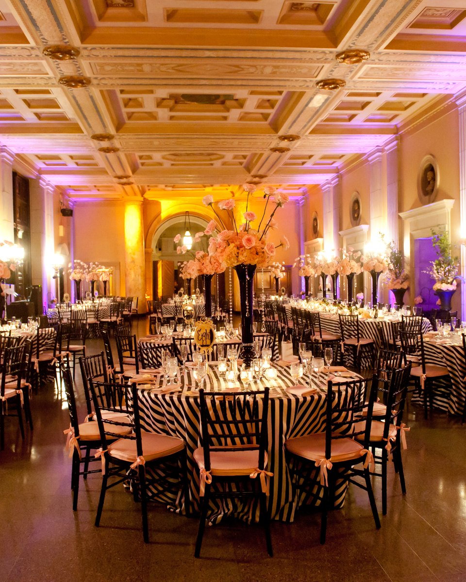 Grand ballroom reception with dramatic lighting